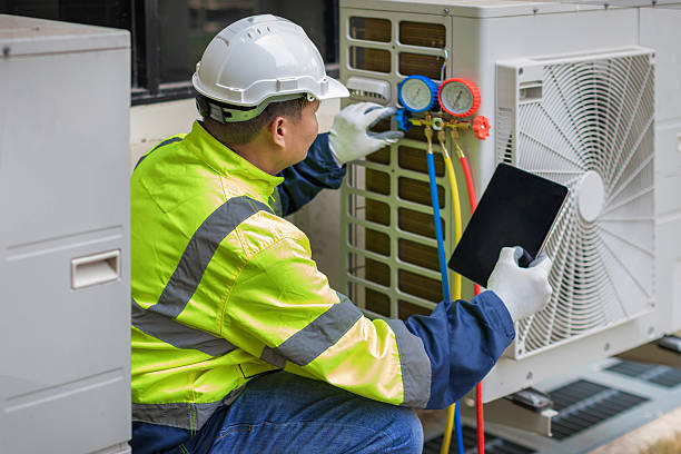 Professional Hvac Maintenance technician working in Summerfield, NC